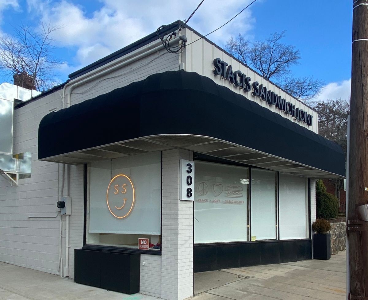 Branded commercial awning over a professional office entrance