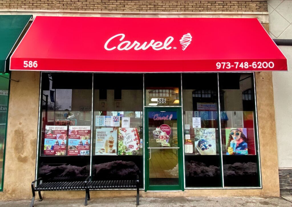 Illuminated channel letters on a New Jersey storefront at night