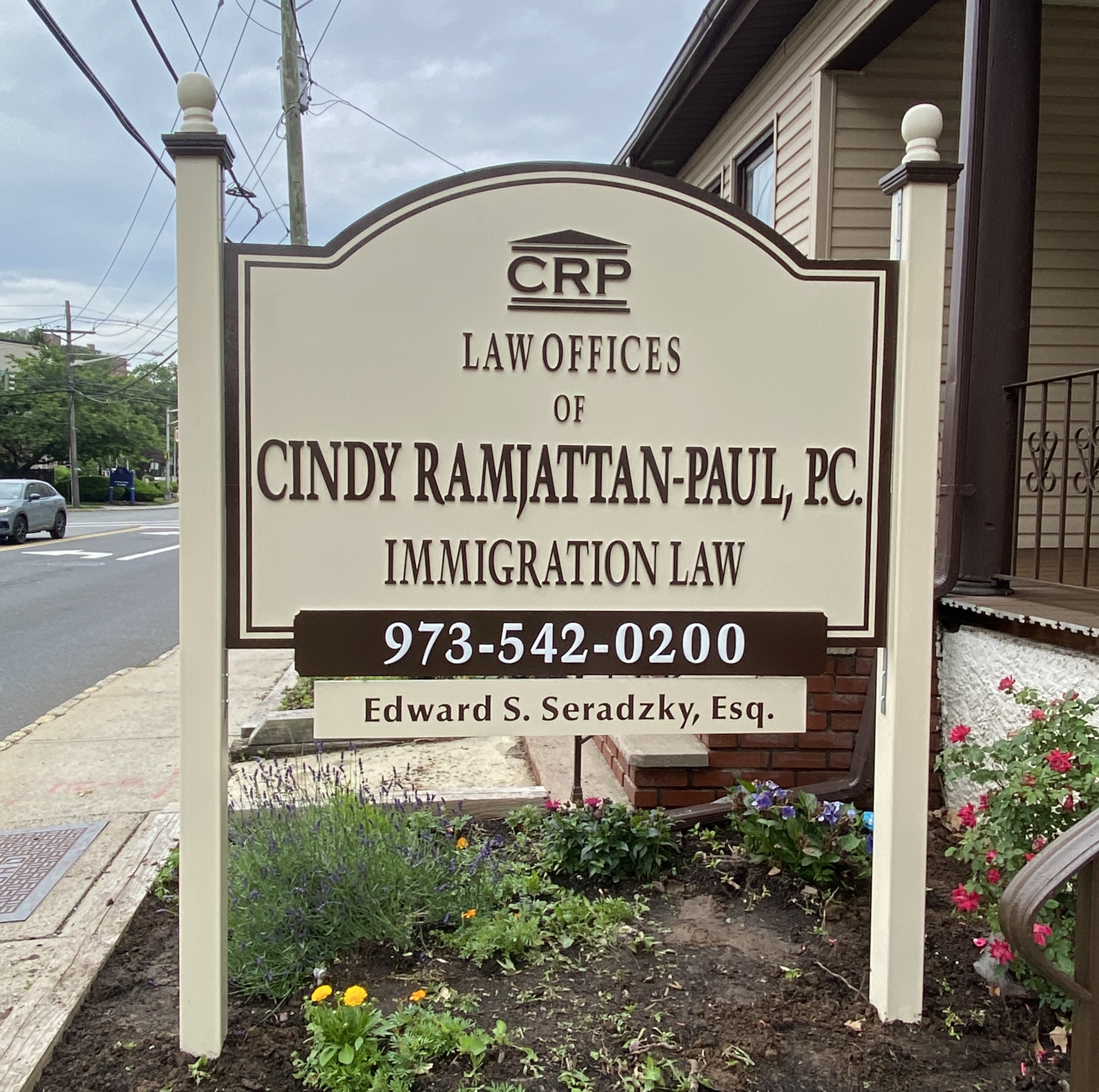 Non-illuminated stone monument sign at a residential community entrance