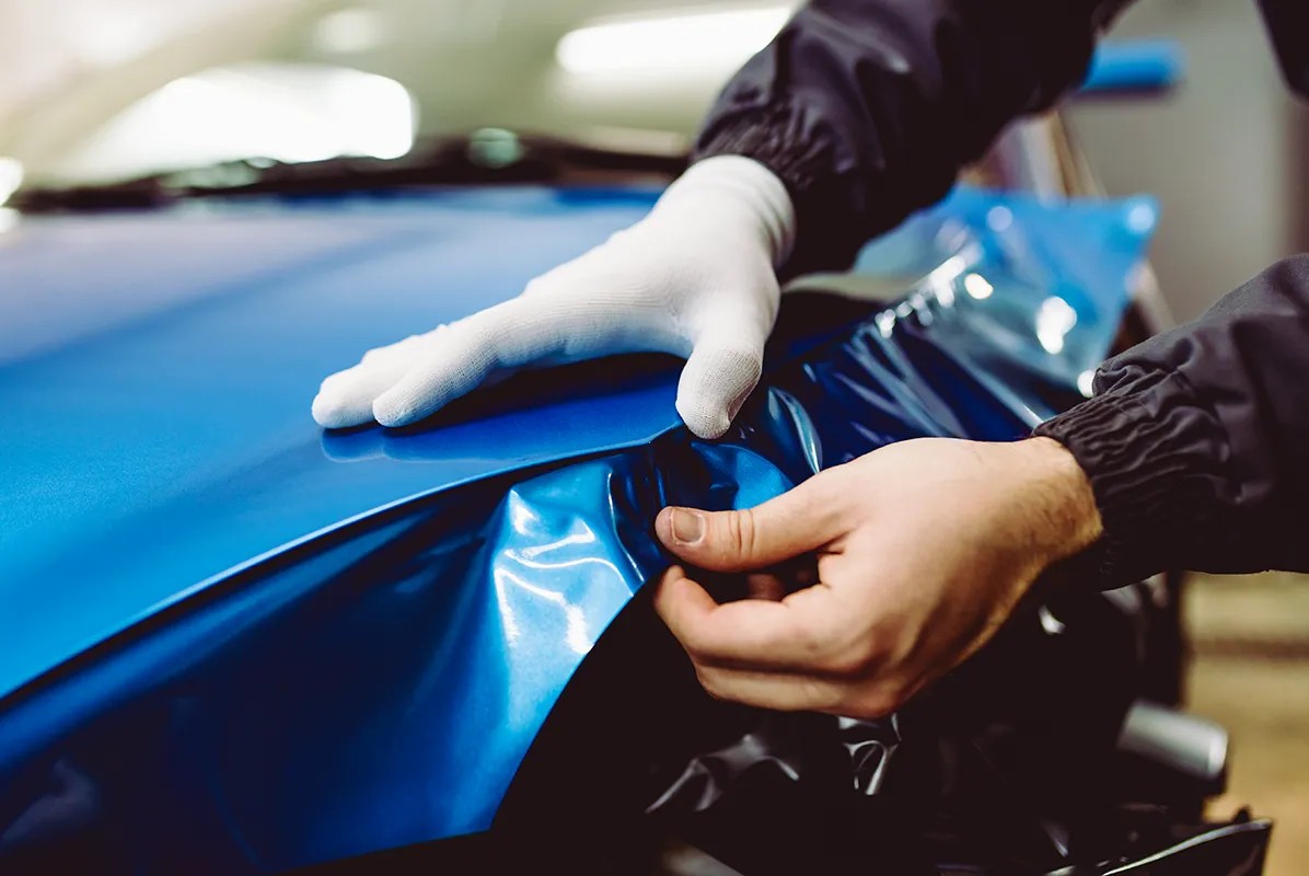 AVI Design team installing a vehicle wrap on a commercial truck