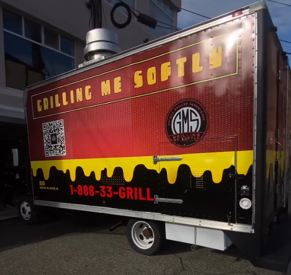 Full vehicle wrap on a commercial box truck with vibrant brand graphics